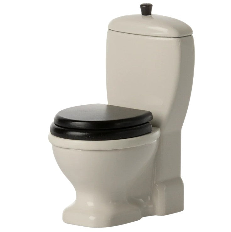 The Maileg Toilet, Mouse by Maileg is a small white dollhouse miniature with black seat and lid, plus a rounded tank and base—ideal furniture for mouse-sized play. Set on a plain white background.