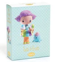 The DJECO Tinyly Tutti & Frutti toy box by DJECO features an adorable miniature collectible doll with purple hair holding ice cream, dressed in a colorful outfit, and standing beside a small blue creature. The packaging displays the names "Tutti & Frutti" and "Tinyly" on a light patterned background, highlighting this charming Tinyly collectible figure.