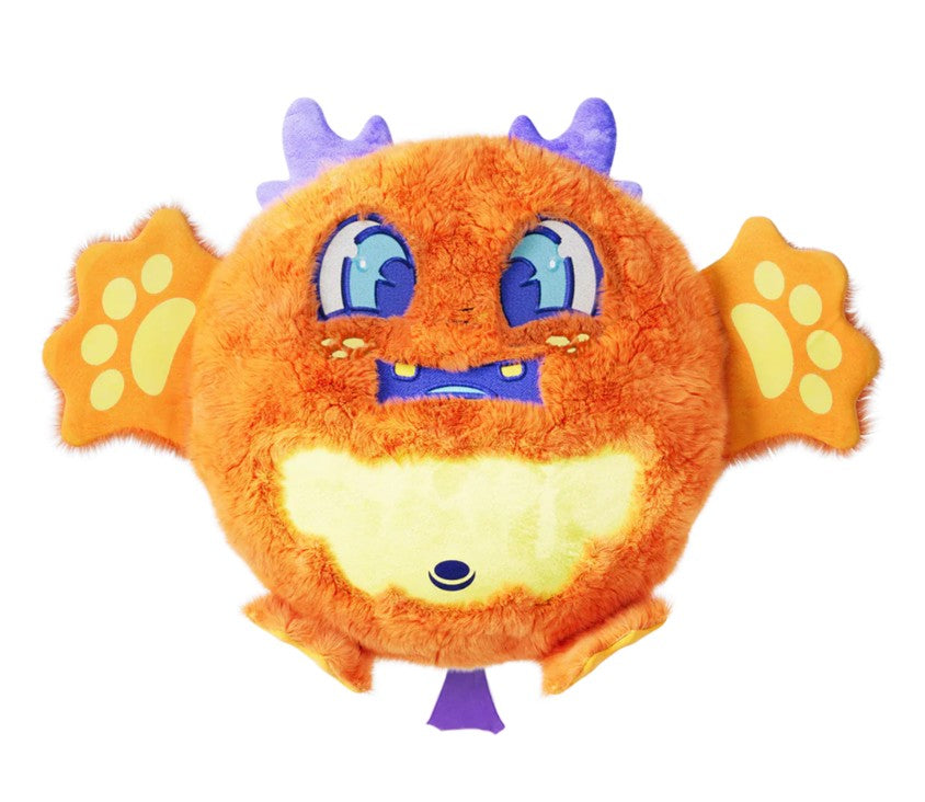 The 10" Fart Monsters: Juicy (Orange Juice) plush toy from Scentco features a round, orange body with purple horns, blue eyes, a large yellow mouth, wing-like arms adorned with paw prints, and small yellow feet—making this cuddly monster look especially delightful against a white background.