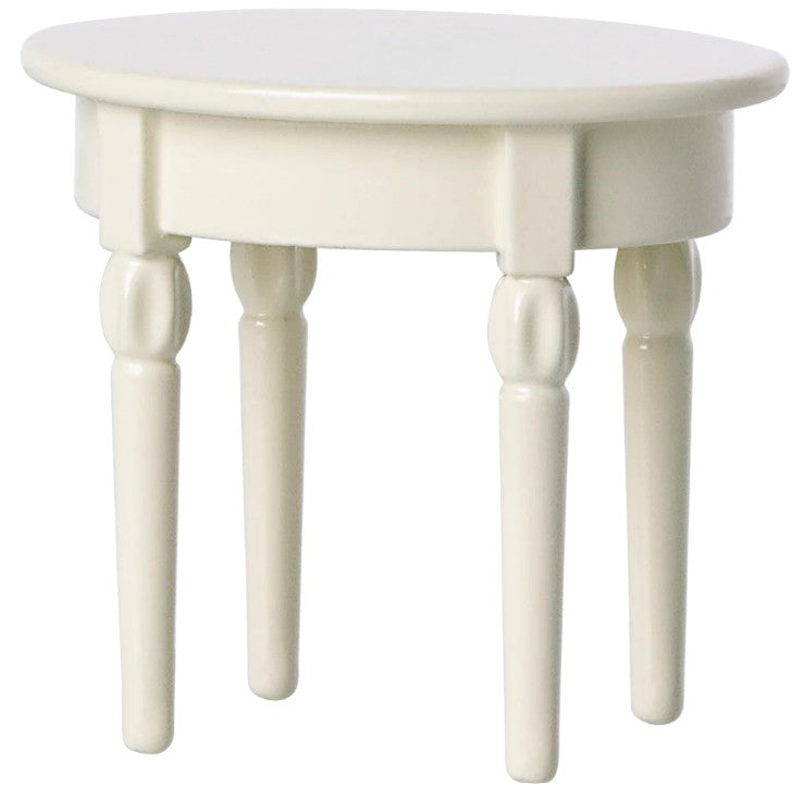 The Maileg Side Table, Mouse by Maileg is a small white wooden oval table with four turned legs, ideal for dollhouses or Maileg Mouse furniture, pictured on a plain white background.