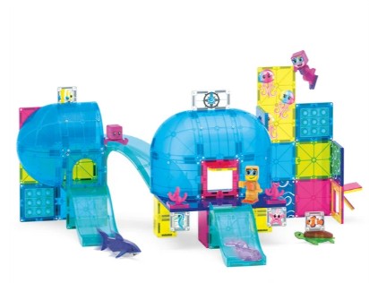 The Magna-Tiles Undersea Adventure 58-Piece Set by Magna-Tiles is a vibrant underwater playset featuring blue domes, blocky character figures, and slides. Inspired by ocean life, this set includes magnetic building pieces decorated with sea-themed elements and comes with plastic dolphins, fish, an octopus, and various creative structures for imaginative aquatic adventures.