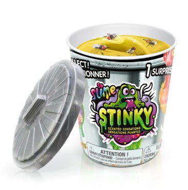 The So Slime Stinky Slime by License 2 Play is a toy container designed to look like a trash can, complete with a lid and filled with yellow slime topped with fake flies. The packaging showcases a cartoon monster and includes surprise scents for extra sensory play.