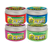Four vibrant jars of License 2 Play’s Toxic Waste Slime Licker Scented Fluffy Slime, each with a cartoon face on the lid, are arranged in two rows. The jars come in red, blue, pink, and green—each one labeled “Toxic Waste Slime Licker Scented Fluffy Slime.” Perfect for sensory play, these colorful containers are sure to delight slime enthusiasts—just don’t confuse them with real Toxic Waste Slime Lickers!.