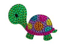 StickerBean Taylor by StickerBean is a decorative sticker featuring a cartoon turtle with a green head and legs, and a shell embellished with vibrant pink, purple, yellow, blue, and orange rhinestones—perfect for adding a splash of color to your notebooks, journals, or planners.