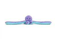 Hugarounds Indigo the Octopus by Hugimals World is a calming stuffed animal with a smiling face, purple and blue colors, and two long outstretched arms, shown lying on a white background.