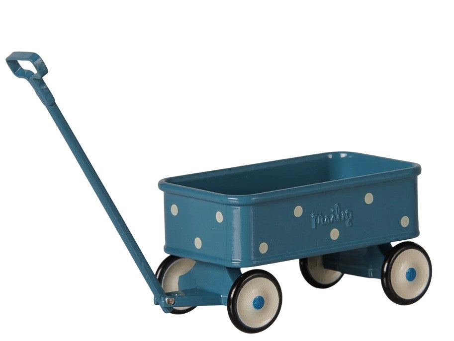 The Maileg Wagon, Mouse - Blue by Maileg is a charming miniature wagon in blue with white polka dots, featuring a pull handle and four white wheels with black rims—ideal for pretend play or taking Maileg mice on delightful little journeys.