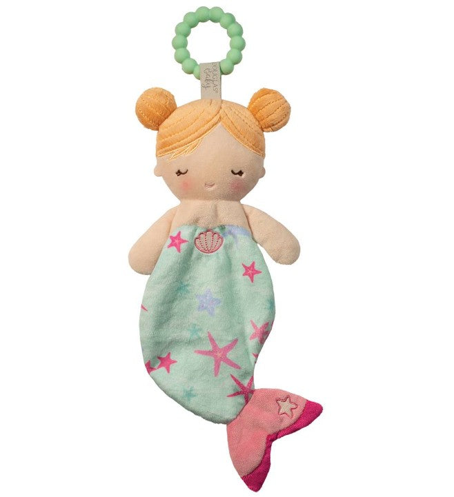 The Douglas Cora Mermaid Teether is a plush doll with orange hair in buns, closed eyes, a light blue tail with pink and purple starfish, a pink fin, and a green silicone teething ring—ideal as a soft mermaid teether for babies.