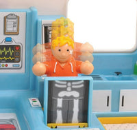 The Robins Medical Rescue playset by Smart Toys features a blonde toy figure in an orange hoodie popping up from behind an X-ray screen in a blue and white hospital-themed set, with motion blur for action and imaginative play.