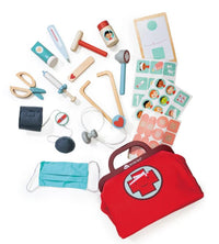 The Tenderleaf Doctors Bag is a kids' pretend play medical kit with a red wooden bag, child-sized tools like a stethoscope, syringe, thermometer, scissors, clipboard, ointment tube, stickers, mask, glasses & more accessories.