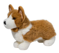 The Douglas Ingrid Corgi is a soft plush dog with brown and white fur, black nose, upright ears, and short legs—perfect for cuddling or display.