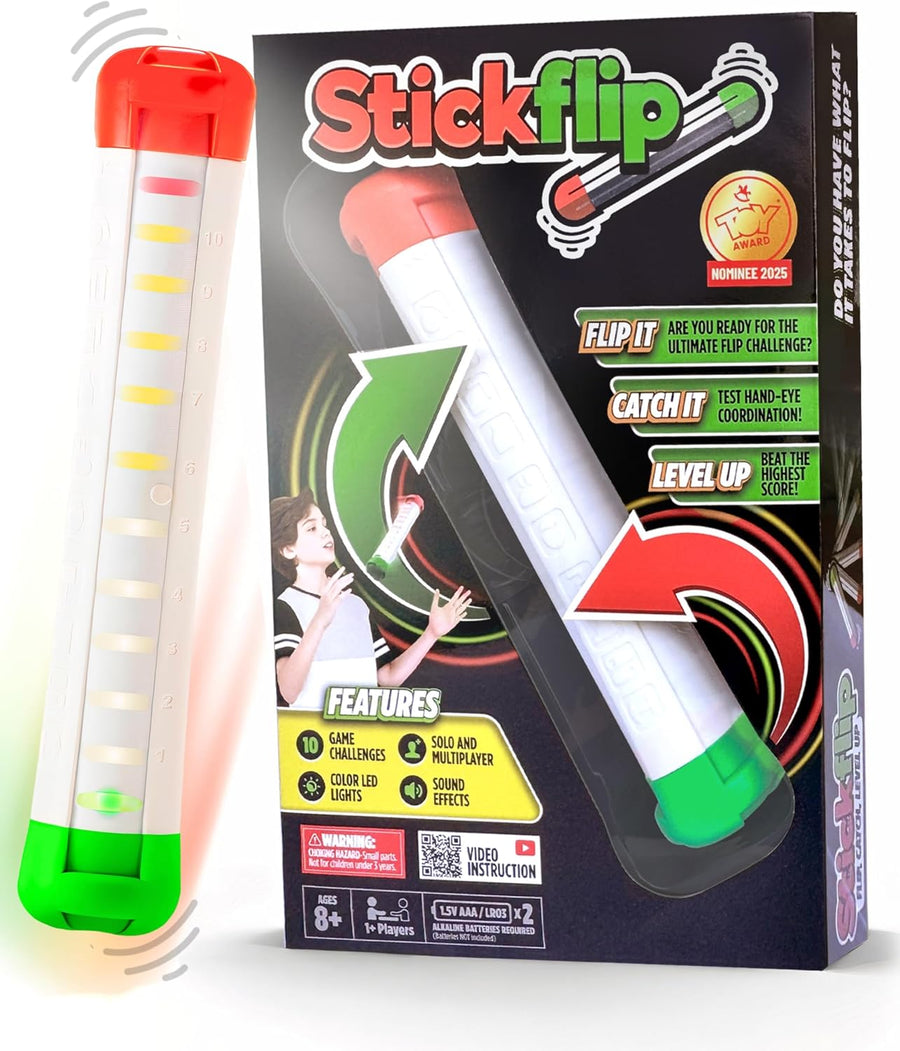 A toy named Stickflip from ImagiNew Playhome, featuring LED lights, is displayed alongside its packaging, which showcases key features, an age recommendation of 8+, and images of a child playing. The box includes graphics and text outlining the portable game’s skill-building challenges designed to enhance hand-eye coordination.