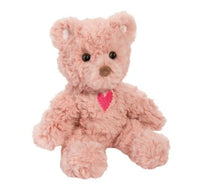 The Douglas Blush Valentine Teddy is a fluffy light pink plush toy with black eyes, a brown nose, and a small red heart on its chest—perfect as a Valentine's Day gift.