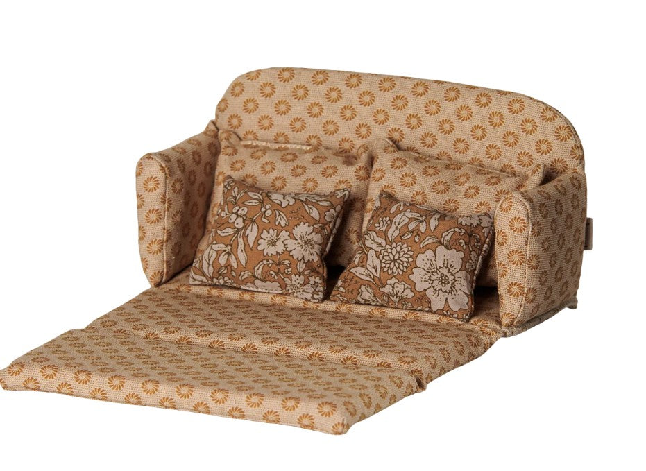 A large, ocher Maileg Sofa bed for mice, featuring two matching pillows and shown unfolded to display its bed function, is set against a white background.