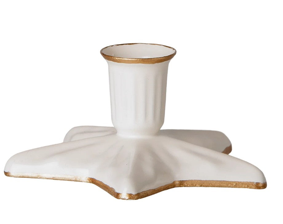 The Maileg Candle Holder, Star, Small by Maileg is a white, star-shaped decorative piece with gold trim along the edges and opening. Featuring a fluted cup design and a flat, wide star-like base, this charming candle holder adds an elegant touch to any décor.
