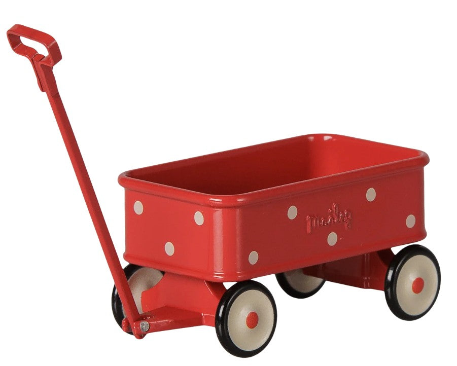 The Maileg Wagon, Mouse - Red by Maileg features a charming red design adorned with white polka dots, four white wheels with black rims, and a convenient pull handle—ideal for Maileg mice to embark on their miniature adventures.