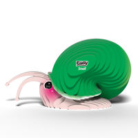 A cute, cartoon-style snail with a big green shell and pink face sits on white. Its shell is labeled EUGY Snail—a fun 3D puzzle and eco-friendly toy from Eugy, featuring expressive eyes and antennae.