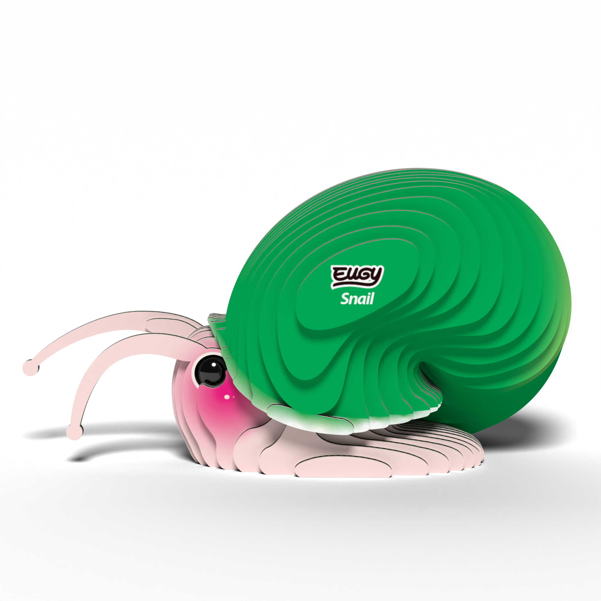 A cute, cartoon-style snail with a big green shell and pink face sits on white. Its shell is labeled EUGY Snail—a fun 3D puzzle and eco-friendly toy from Eugy, featuring expressive eyes and antennae.