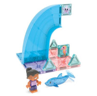 Radiating the magic of an ocean-themed playset, the Magna-Tiles Dolphin Bay 13-Piece Set by Magna-Tiles features colorful magnetic building pieces arranged in a wave with a seahorse motif. A cheerful toy figure with dark hair and a blue dolphin figure sit in front of the structure, evoking imaginative adventures under the sea.