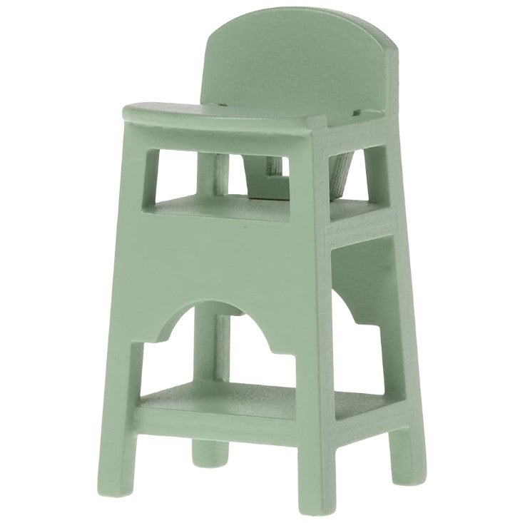 The Maileg High Chair, Mouse - Mint by Maileg is a small, mint green plastic chair with a minimal design, built-in tray, backrest, and open cutouts—perfect for baby mice accessories or as dollhouse furniture.