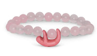 The Wander - Wildflower Pink Sloth bracelet by fahlo features round pink beads and a cute sloth charm—perfect for wildlife conservation enthusiasts.