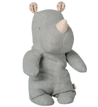 Maileg Safari Friends, Rhino, Small – Vintage Blue is a charming stuffed toy by Maileg featuring soft vintage blue fabric, beige speckled inner ears, and a beige horn. This small rhino has a classic design with minimal facial features and sits upright facing slightly to the right—an adorable addition to any collection.