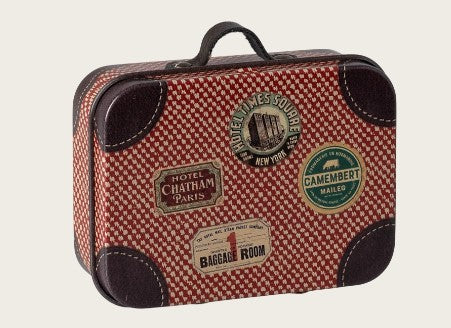 The Maileg Suitcase, Micro - Red by Maileg features a charming red and white checkered pattern, brown corner accents, and whimsical travel stickers from destinations such as Paris, New York, and Camembert—ideal for pretend play adventures or packing essentials for imaginative miniature journeys.