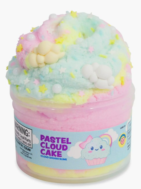 A clear jar labeled "Pastel Cloud Cake Slime" by Peachybbies Slime features fluffy, pastel-colored slime adorned with star and pearl decorations and topped with adorable cloud-shaped ornaments. Enjoy a soothing, cloud-like texture and delightful slime ASMR as you play with the charming Pastel Cloud Cake Slime from Peachybbies Slime.