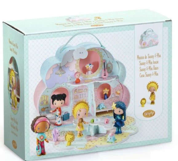 A pastel-colored box displays the DJECO Tinyly Sunny & Mia House playset by DJECO. The front showcases the assembled miniature home, with tiny figures and accessories set up inside and around the charming playset to spark imaginative play.