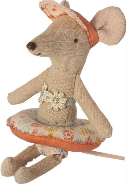 A Maileg Small Mouse is ready for swimming or a beach day, accessorized with the charming Maileg Float, Small mouse - Flower from Maileg, along with a lacy top and patterned sun visor.