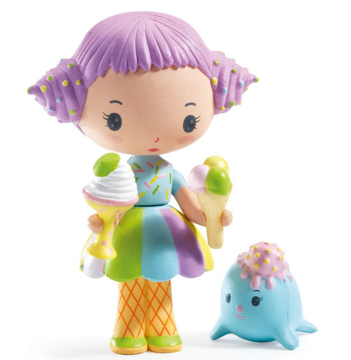 Meet DJECO Tinyly Tutti & Frutti, a delightful collectible figure from DJECO featuring Tutti with vibrant purple hair. She’s dressed in a playful rainbow dress and orange grid-patterned tights, holding an ice cream cone and a sundae. Beside her sits Frutti, an adorable blue seal topped with a sprinkle-covered scoop—perfect for imaginative play or collecting!.