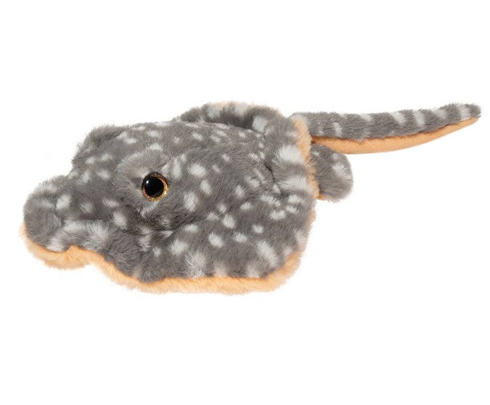 Stella Stingray by Douglas is a plush stuffed animal with soft gray fur, white spots, a tan underside, long tail, and shiny black eyes—perfect for sea life lovers.