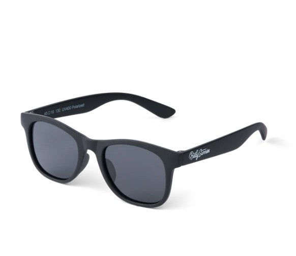 Introducing the Black Kids Polarized Sunglasses by Baby Sunnies, designed for ages 3-8 years. These stylish shades feature a classic wayfarer frame with a matte black finish and dark polarized lenses for superior UV protection. Adorned with a white Baby Sunnies logo on the left temple, they combine modern flair with eye safety, making them ideal for kids who want both functional sun protection and sleek style—all showcased beautifully against a white background.