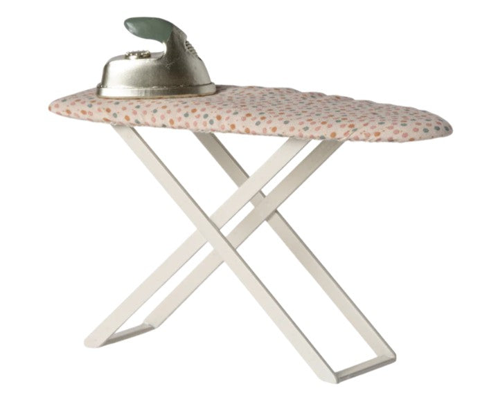 The Maileg Iron and ironing board, Mouse by Maileg features a small polka-dotted ironing board with crossed white legs and comes topped with a silver toy iron that has a green handle—perfect for completing your miniature ironing set or enhancing your collection of Maileg mice accessories.