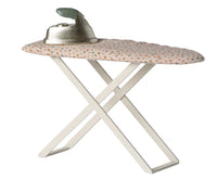 The Maileg Iron and ironing board, Mouse by Maileg features a small polka-dotted ironing board with crossed white legs and comes topped with a silver toy iron that has a green handle—perfect for completing your miniature ironing set or enhancing your collection of Maileg mice accessories.