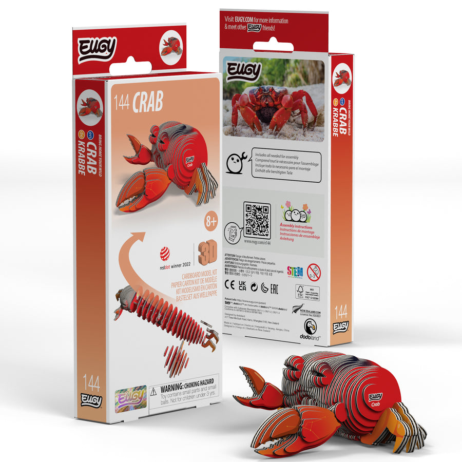 The EUGY Crab 3D Puzzle by Eugy is a fun and eco-friendly STEM craft kit. The packaging features a red crab model, assembly instructions, real crab photo, age recommendation, safety warnings, and QR codes.