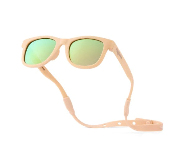 Introducing the Baby Sunnies Peach Baby Polarized Sunglasses, designed for ages 0-24 months. Featuring peach frames with green polarized UV-protective lenses and an attached adjustable strap, these sunglasses are displayed against a white background.