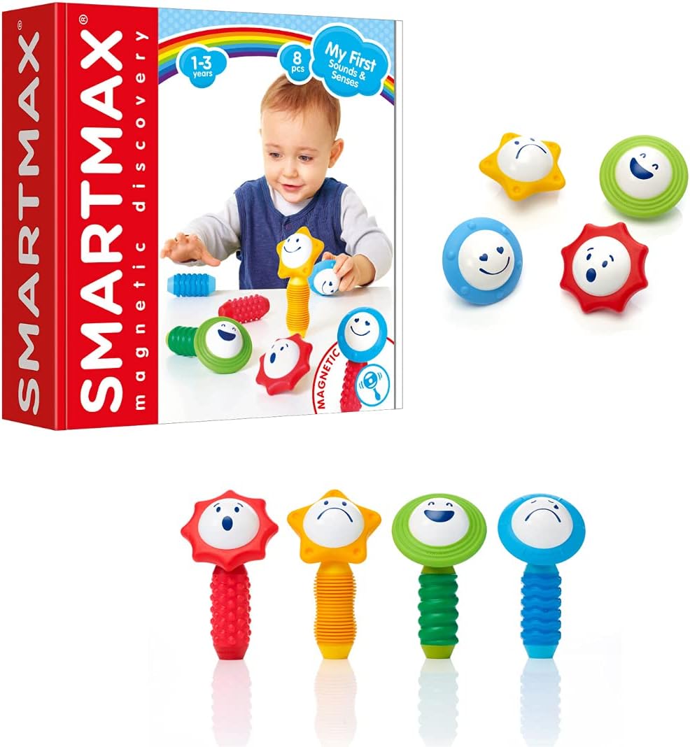 Smart Toys’ Smartmax My First Sounds & Senses is a magnetic building set for ages 1-3, featuring colorful, textured pieces with smiling faces to encourage sensory play. The box shows a child playing with four assembled pieces and three faces visible.