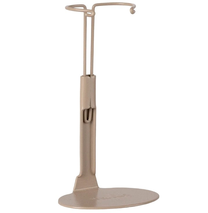 The Maileg Stand, Medium - Mouse Sand by Maileg is a beige metal stand with a circular base and adjustable support—ideal for displaying medium dolls or enhancing your dollhouse accessories.