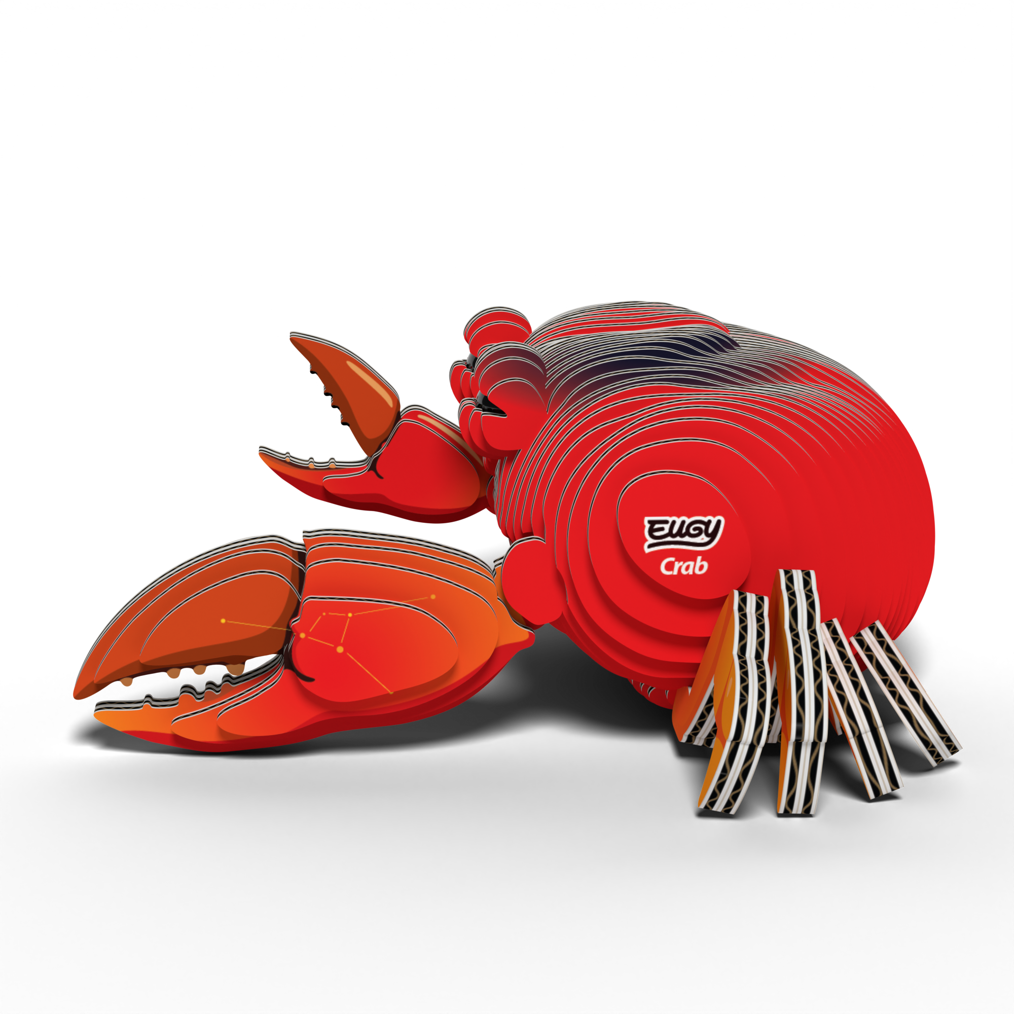 The EUGY Crab 3D Puzzle by Eugy is a colorful, layered model featuring a red crab with large claws and striped black-and-white legs. This eco-friendly toy serves as both a fun STEM craft and an educational activity. The words "Crab" and the brand name "Eugy" are visible on its body, all set against a plain white background.