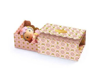 The DJECO Tinyly Rose Tinyroom by DJECO is a decorative pink floral box that opens to reveal a charming Tinyly room with two small dolls in pastel hats and dresses, perfect for inspiring imaginative play.