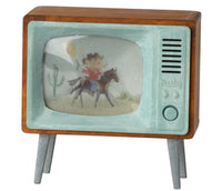 The Maileg Television, Mouse by Maileg is a vintage-style accessory featuring a wooden frame, four legs, and a cartoon cowboy on screen. Painted light blue and brown, it's ideal for any Maileg Mouse dollhouse.