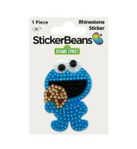 A sparkling rhinestone sticker featuring Cookie Monster with blue fur and googly eyes eating a cookie, the StickerBean Cookie Monster by StickerBean brings fun Sesame Street charm to your collection.
