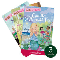 Three colorful Yoto American Girl: WellieWishers Whimsical Adventure cards are fanned out, with the front showing a girl in a mermaid costume titled "Camille’s Mermaid Tale." Enjoy these audio stories on your Yoto Player. 3 cards included.