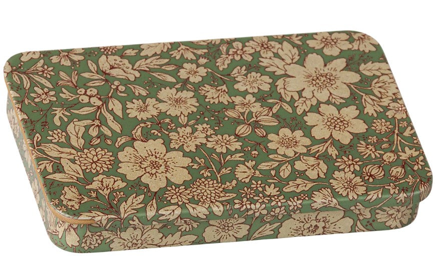 The Maileg Metal box with sliding lid - Blossom - Blue features a charming rectangular design adorned with a delicate blue background and beige floral pattern, making it the perfect keepsake box for storing your treasured mementos.