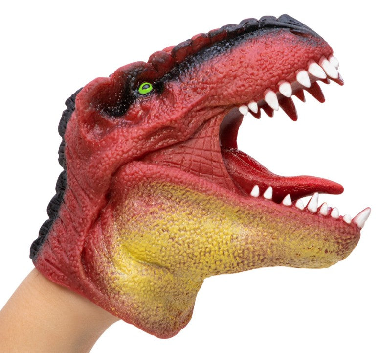 A person’s hand is inside the Schylling Toys Dinosaur Hand Puppet, featuring bright red and yellow colors, an open mouth with sharp white teeth, and a green eye—perfect for imaginative play and storytelling adventures.