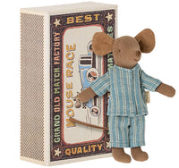 The Maileg Big Brother Mouse in Matchbox by Maileg features a small mouse in blue-striped pajamas and a decorative matchbox bed with vintage-style Mouse Race artwork.