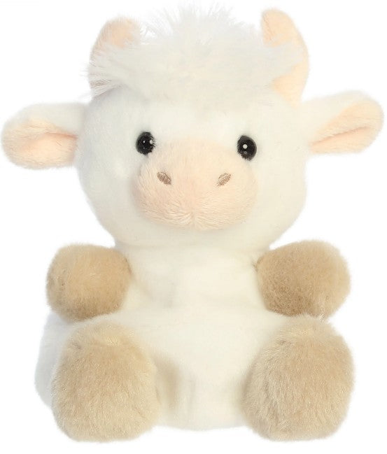 The 5" Halleigh Highland Cow by Aurora is a plush white and tan stuffed animal featuring soft fur, round black eyes, a beige snout, tan feet, and small beige horns. Sitting upright against a plain white background, it's perfect as a collectible toy for any animal lover.