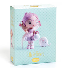 A DJECO Tinyly Elfe & Bolero toy box featuring a collectible figure—a doll with pink hair, a lavender outfit, and a small white elephant companion. The packaging displays the DJECO brand name and has a light blue patterned background with "Elfe & Bolero," making it the perfect fantasy toy for imaginative play.