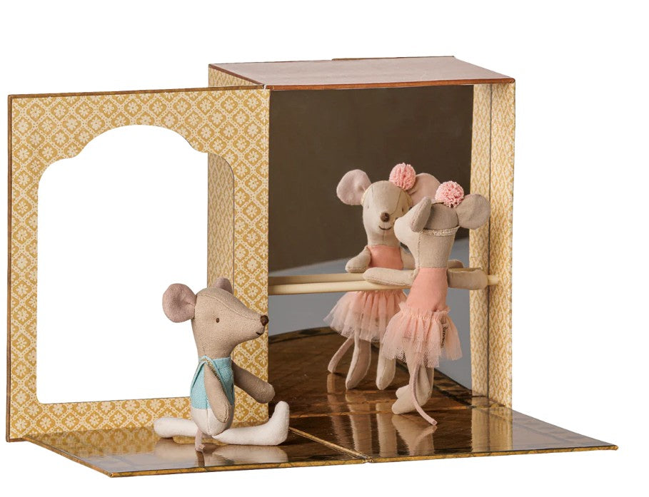 The Maileg Ballet mice in dance studio, Little sister and brother set by Maileg features three toy mice—two dressed in pink and one in blue—posing at the barre inside a ballet-themed miniature studio with gold-patterned walls and a mirror, inspiring imaginative play.
