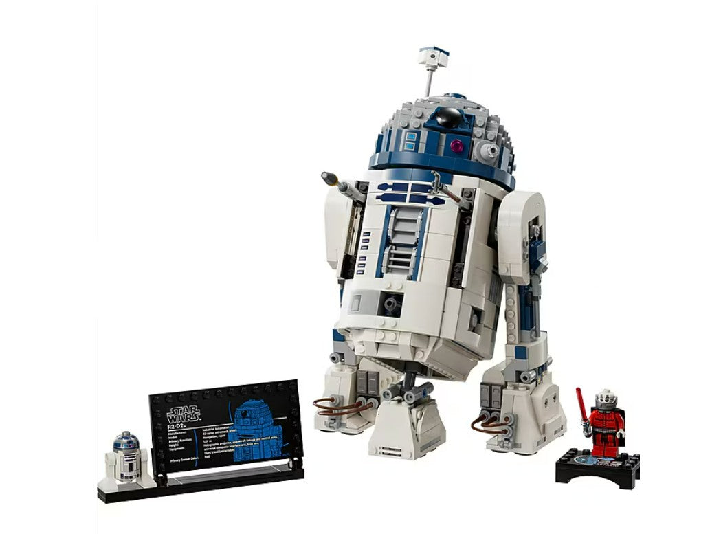 This LEGO R2-D2 collectible display model by LEGO features a meticulously crafted R2-D2, an information plaque, a miniature R2-D2 figure, and a red Star Wars minifigure with a red lightsaber, all displayed on a plain white background. Ideal for fans and collectors alike, this LEGO Star Wars building set brings iconic charm to any collection.